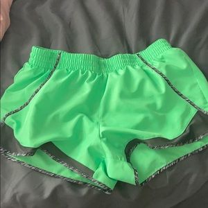Green running shorts